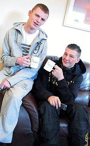 CHEERS. . . Carl McDermott, left, and Martin Lloyd toast the first birthday of their supported housing
CHEERS. . . Carl McDermott, left, and Martin Lloyd toast the first birthday of their supported housing