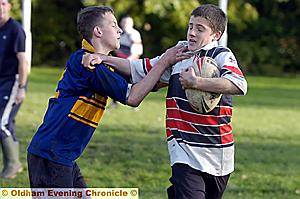 GET BACK: James Rattue, of Failsworth, attempts to break clear in the Oldham Schools Year Nine festival at Manor Park.
