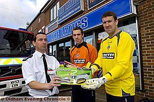 SAFETY FIRST . . . Latics keepers Greg Fleming (left) and Mark Crossley launch the campaign at Boundary Park with Geoff Harris, Oldham’s divisional fire commander.
SAFETY FIRST . . . Latics keepers Greg Fleming (left) and Mark Crossley launch the campaign at Boundary Park with Geoff Harris, Oldham’s divisional fire commander.