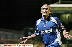 MAGIC MOMENT: Lewis Alessandra celebrates after completing his hat-trick (inset) in the 3-0 triumph over Scunthorpe United last night. 
Hat-trick hero Lewis shows star quality as Iron are blown away 
