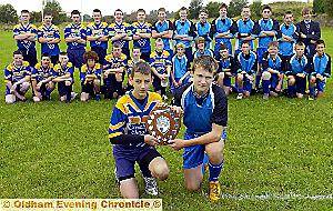 ON PARADE: Counthill captain Jamie Mayall (front, left) and Saddleworth counterpart Ben White pictured before the Oldham Schools Year Eight final at Manor Park held over from last season. In a hard-fought battle, which saw the lead change several times, Saddleworth secured a 32-22 success.

Josh Queenan, of Counthill, was named man-of-the-match. 