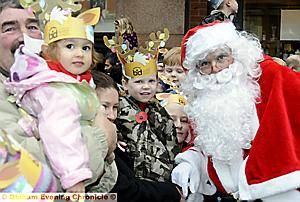 PAIGE Kershaw (3) and Ben Devall (4) are among the first to meet Father Christmas 