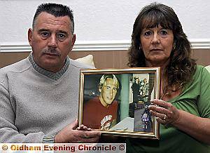 Jimmy and Susan Gray with a picture of their late son Mark, at the home in Middleton Road, Chadderton Jimmy and Susan Gray with a picture of their late son Mark, at the home in Middleton Road, Chadderton