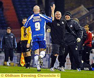 Lee Hughes celebrates with Tommy Wright after his late winner 