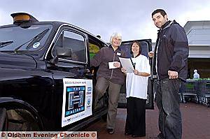 QUESTIONED . . . shopper Mary Whitely is pictured with Gail Richards (centre) and interviewer Ric Perrin 