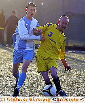 ARM-IN-ARM: Chris Pauley (above, left) gets to grips with a Wellington ‘A” team opponent. 
