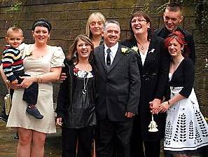 NIGEL Lindley and wife, Gail (third right), on their wedding day with their family NIGEL Lindley and wife, Gail (third right), on their wedding day with their family