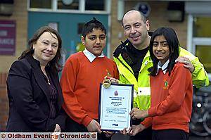 EVERYONE a winner . . . Irene Barratt, head teacher, Tasiq Ali, head boy, PC Ian Mc Donald and Zoha Arshad, head girl 