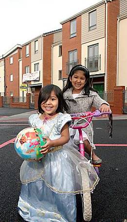 PLAYTIME . . . for sisters Tahsin Kabir (left) and Nuzhat Kabir 

