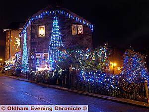 TWINKLING . . . Tom Newbold and Michael Powis of Wood Lane, Dobcross scooped the best illuminated small residential property prize 
