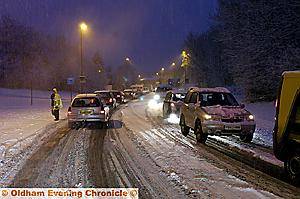 WHITE HELL: THIS was the scene in Lees Road, Oldham, this morning as heavy overnight snow and sub-zero temperatures brought chaos to the borough. Commuters faced an icy crawl to work and schools were forced to close for the day. Delph was cut off and other drivers were forced to abandon their vehicles. 