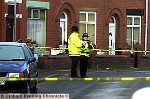 SEARCHING for clues . . . police try to piece together what happened 
