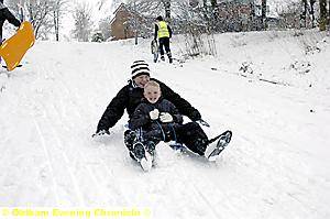 WHEE . . . Ryan Duffy (15) with cousin Luke Brierley (10) in Waterhead 