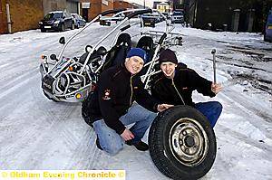 THE ICE MEN. . . Wayne Williams and Aaron Haigh loaded their little Bug Rider with their repair tools and a spare tyre to cut a swathe through the snow 