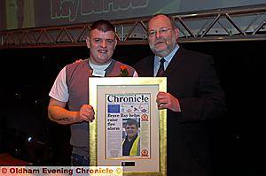 Fire-rescue hero Ray Barlow receives his Special Achievement category finalist award from MP David Heyes. 