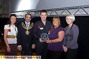 Inspire Hair Salon receive their Business category trophy from the Mayor of Oldham Cllr Shoab Akhtar 