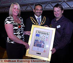 Jackson’s Shoe Repair shop receive their award as finalists in the Business category from the Mayor of Oldham Cllr Shoab Akhtar 