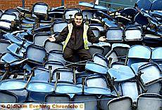 SEATS YOU, SIR: Workman Sean Garrett with some of the seats from the Broadway Stand. SEATS YOU, SIR: Workman Sean Garrett with some of the seats from the Broadway Stand.