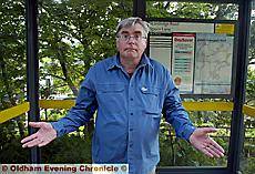 GOING nowhere . . . Councillor Ken Hulme in the unused shelter GOING nowhere . . . Councillor Ken Hulme in the unused shelter