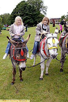 SADDLE up . . . Grace (5) and Hollie (6) Appleby have a donkey ride SADDLE up . . . Grace (5) and Hollie (6) Appleby have a donkey ride