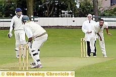 Crompton’s Jevon Searles bowls to Middleton’s Steve Davey.