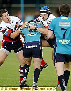 Ian Hodson (Left) and Mick Nanyn stop a Barrow attack in its tracks 
