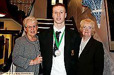 Andrew Martin with his award, and sponsor Sheila Acton, left, of Acton and Acton textile manufacturers, and Maureen Cooper, chairman of Rochdale Childer. 
