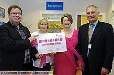 CATCHY logo . . . Maureen Mills (second left) and her winning entry with (from the left) Chris Hamilton and breast surgeons Maria Bramley and Ian McIntosh 