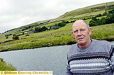 Steven Alderson at the crash site, with the Delph hillside behind him, near to where he was working 