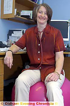 Dr Jane Rothwell, in her surgery, sitting on an exercise ball she uses instead of a chair to maintain her posture
Dr Jane Rothwell, in her surgery, sitting on an exercise ball she uses instead of a chair to maintain her posture