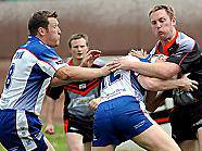 FORWARDS BATTLE: Jason Boults (right) is held 
