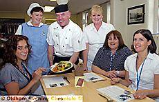 GRUB’S up . . . Jennie Carey prepares to tuck in with (from left) catering assistant Susan Foster, retail chef James Kilbride, restaurant manager Margaret Stafford, hospital chief cashier Julie Owens and Sara Flynn