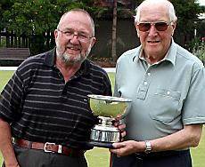 Stan Boston of Crompton receives the trophy from chairman Bryan O'Neill (left).