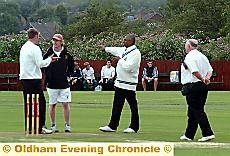 Umpires and captains inspect the wicket 
