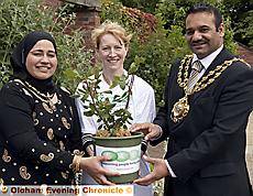 The new rose held by the Mayor of Oldham, Councillor Shoab Akhtar, the Mayoress, Mrs Shafeena Kausar, and Jenny Benson, manager of the Cancer Aid and Listening Line The new rose held by the Mayor of Oldham, Councillor Shoab Akhtar, the Mayoress, Mrs Shafeena Kausar, and Jenny Benson, manager of the Cancer Aid and Listening Line