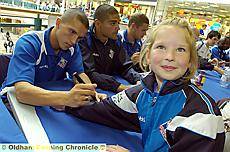 PAUL BLACK signs for seven-year-old Cherrie Gardner 




