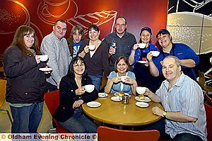 CUPPA cheers! The Macmillan coffee morning event at Sainsbury’s. Back row, from left, are Laura Mitchell, Ian Newton, Grant Knox, Deborah Brennan, Colin Flynn, Ruth Smith and Tony Worrad (Sainsbury’s). Front row, Lisa Saha, Julie and Barry Piggott 