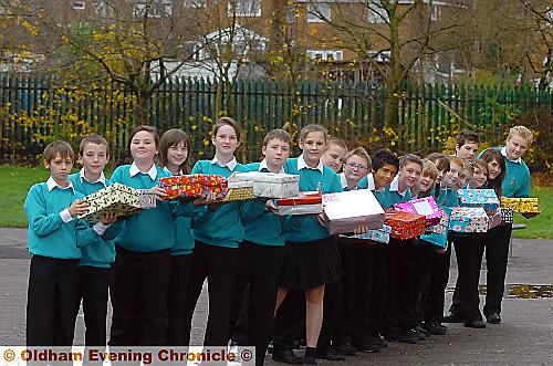 CHRISTMAS angels . . . pupils of Royton and Crompton Specialist Sports College with their shoe boxes 