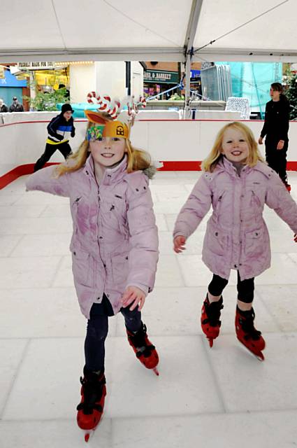 GET your skates on! Eight-year-old Nicole Spate and sister Keira (5) on the town centre rink 