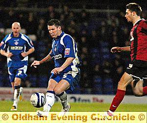 RANGE FINDER . . . Dean Windass produces an early strike at goal on his Athletic debut. 