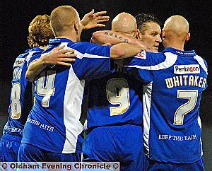 Lee Hughes is congratulated following his first-half opener. 
 