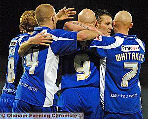 Lee Hughes is congratulated following his first-half opener. 
 