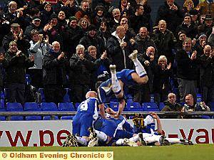 TIME TO CELEBRATE . . . Deane Smalley is lost under a mass of Athletic bodies after scoring his side’s second goal 
