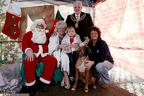 MEETING father Christmas. Nellie the dog with Mayor and Mayoress Councillors Jim McArdle and Kay Knox, Holly Williams and branch manager Mandy Tierney 