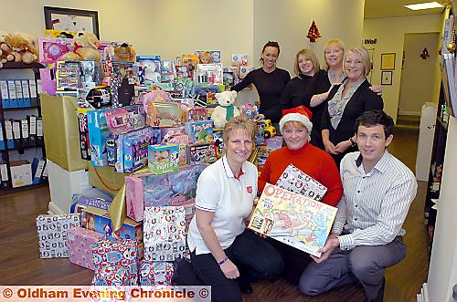 TOYS are us . . . (front, from left) Karen Ogden (Salvation Army), Tracey Holmes (Oldham Chronicle) and Anthony Lavin (Oldham Chiropractic Centre). Back: Claire Harper (Oldham Chiropractic Centre), Sandra Mercer (Salvation Army), Adelle Lancaster and Kath Cantrill (Oldham Chiropractic Centre) TOYS are us . . . (front, from left) Karen Ogden (Salvation Army), Tracey Holmes (Oldham Chronicle) and Anthony Lavin (Oldham Chiropractic Centre). Back: Claire Harper (Oldham Chiropractic Centre), Sandra Mercer (Salvation Army), Adelle Lancaster and Kath Cantrill (Oldham Chiropractic Centre)