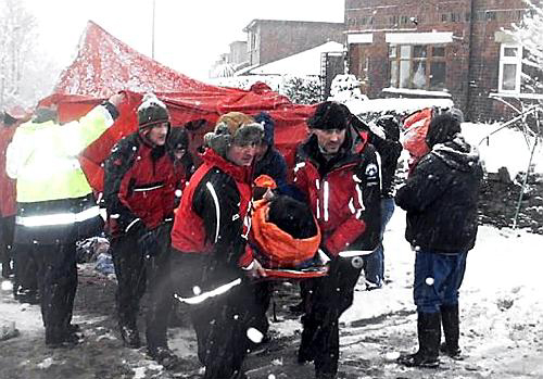 OLDHAM Mountain Rescue Team helps stricken Hughie McDonald.