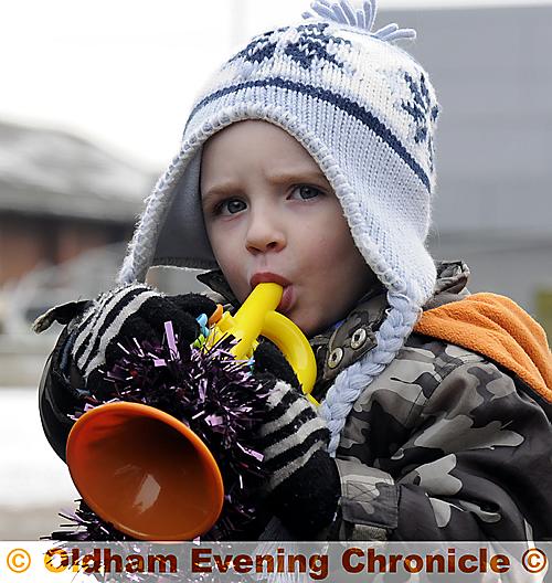 JOINING in... two-and-a-half-year-old Rhys Branwood with his tinsel-trimmed instrument 