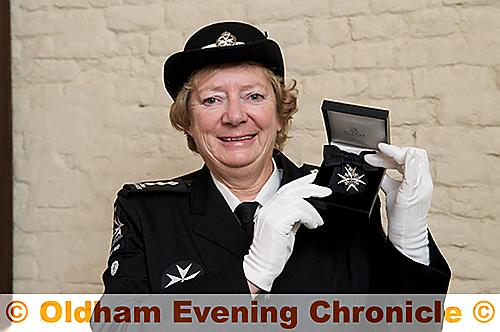 PROUD moment . . . Carol Calvert with her investiture medal PROUD moment . . . Carol Calvert with her investiture medal