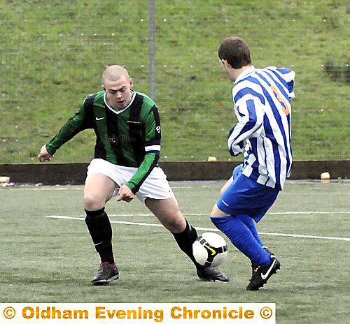Highfield United’s Jake Buckley (left) closes down Gary Chadderton, of Limeside Athletic ‘A’. 