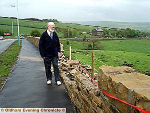 ACCIDENT scene . . . Councillor Heffernan at the spot where three men were killed when their car collided with a bus and hit a wall ACCIDENT scene . . . Councillor Heffernan at the spot where three men were killed when their car collided with a bus and hit a wall